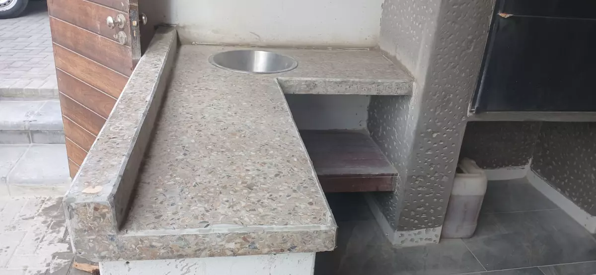 Terrazzo concrete outdoor countertop with stainless steel sink and built-in braai