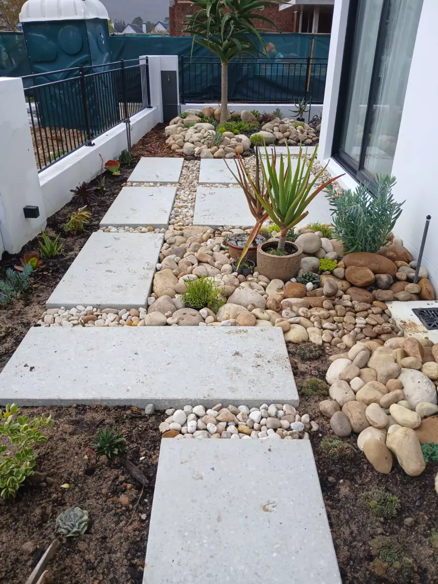 Landscaped walkway with concrete pavers