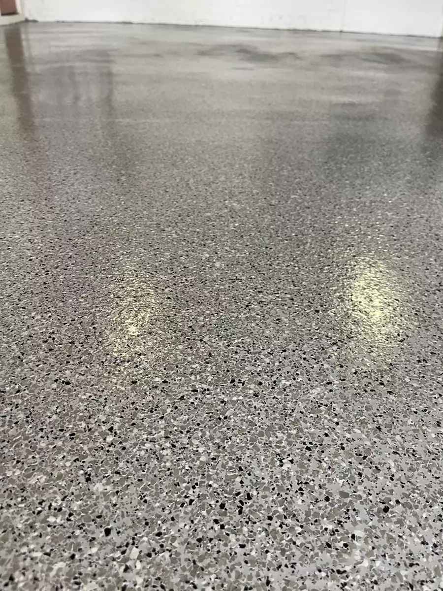 Close-up of speckled epoxy flake floor coating