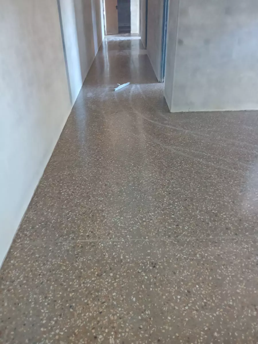 Polished concrete hallway floor with leading lines