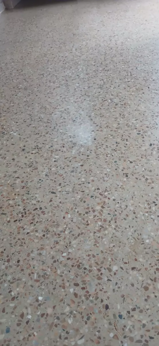 Polished terrazzo floor with multicoloured aggregate chips