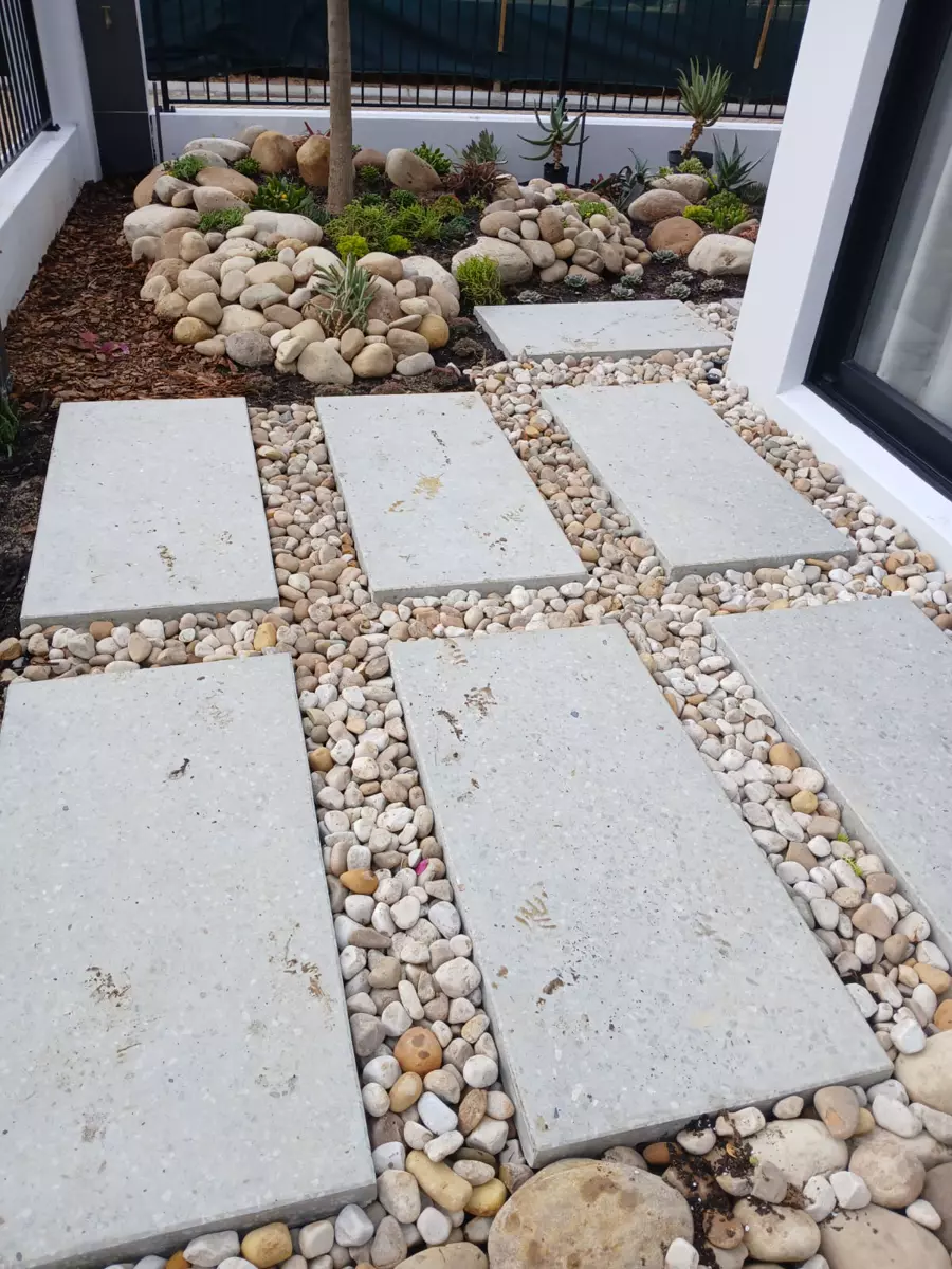 Modern garden pathway with concrete stepping stones