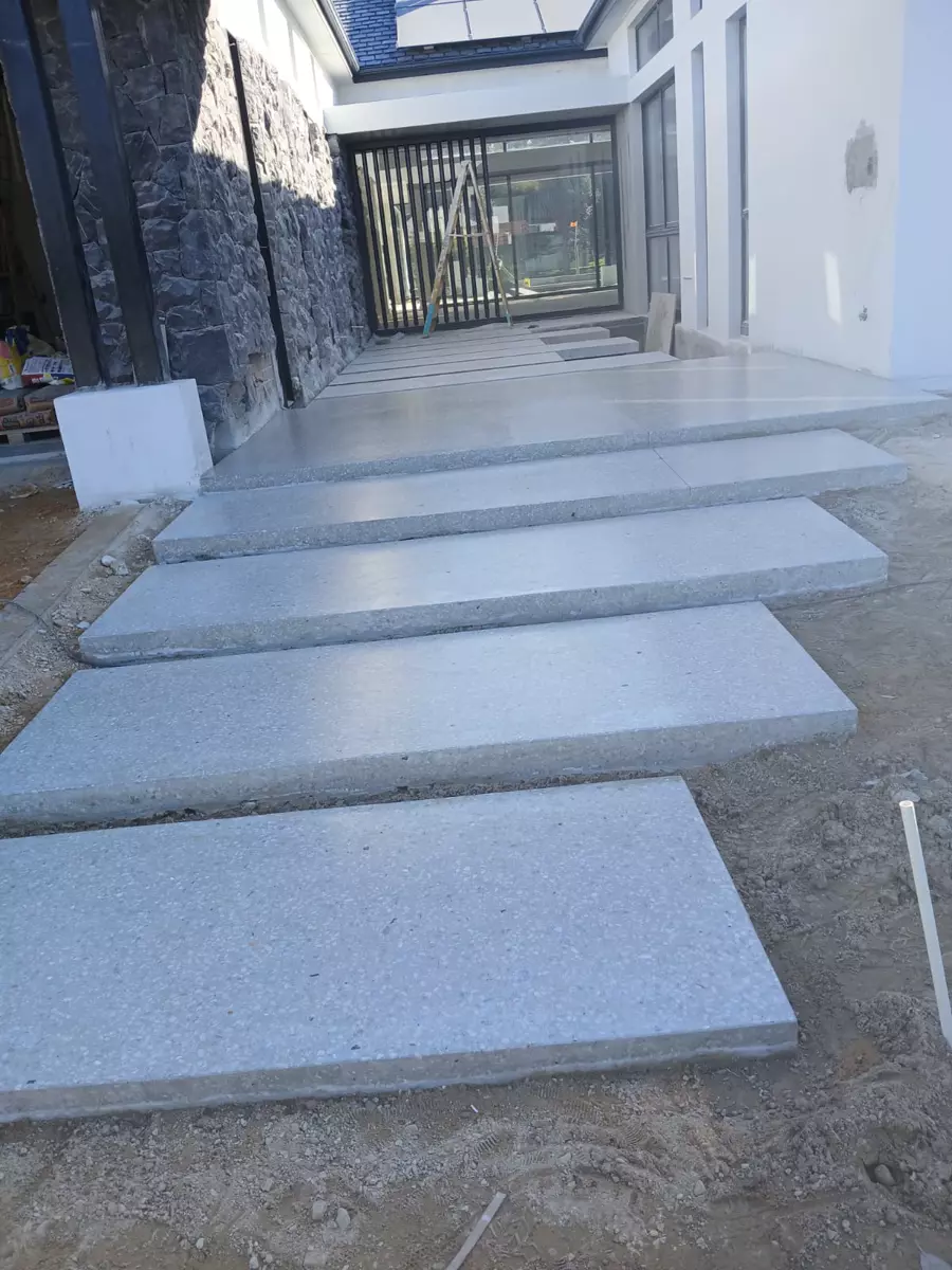 Modern concrete outdoor steps and house entrance